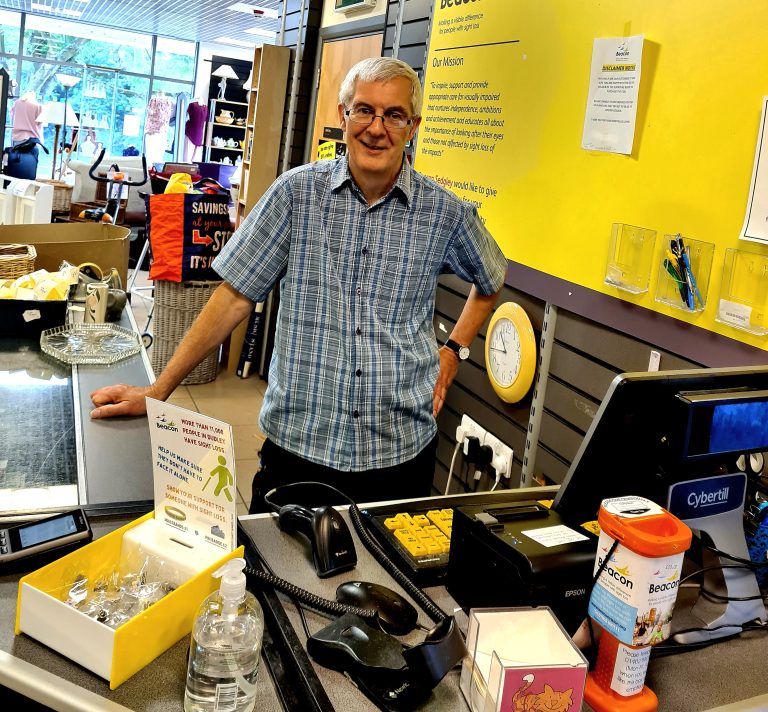 This shows Steve from our Sedgley shop stood next to a till.