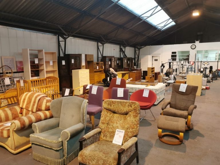 This shows the inside of our Clearance Centre, rows of furniture can be seen.